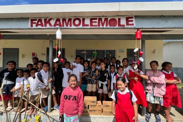 The whole class outside their block with the milk delivery.