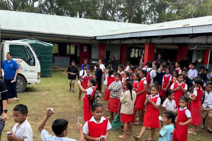 Milk break in the schoolyard as the delivery is shared out.