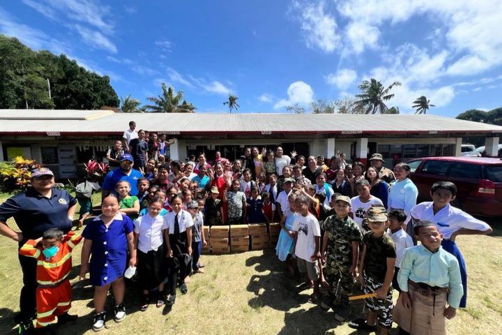 The whole school gathered around the milk delivery on mufti day.
