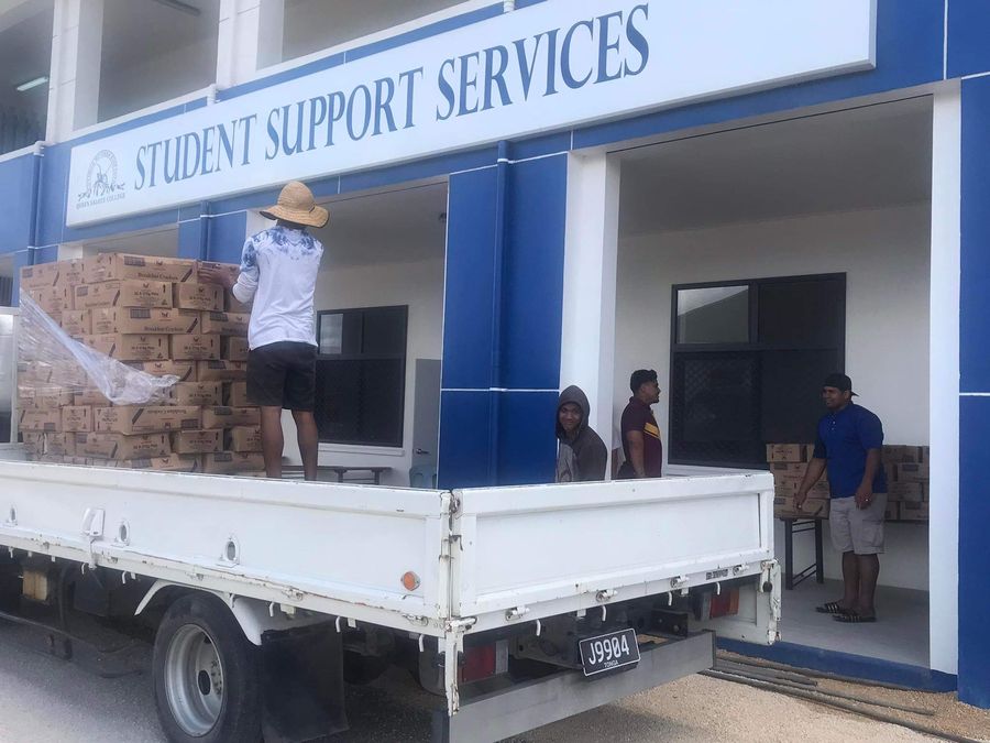 Cartons of breakfast crackers unloaded from the ACS truck at the school.