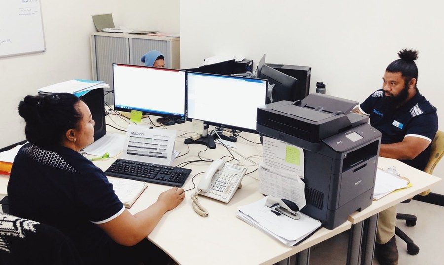 The shipping office at Vuna Road, with Matson schedules and customs paperwork.