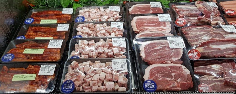 Trays of pork belly, double-smoked bacon and diced pork in the Frankie's Butchery chiller.