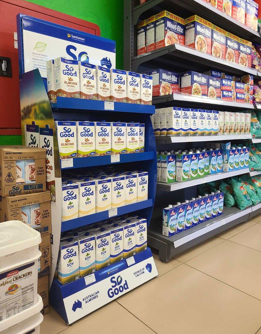 A Tongan store shelf stocked with So Good and other brands distributed by ACS.